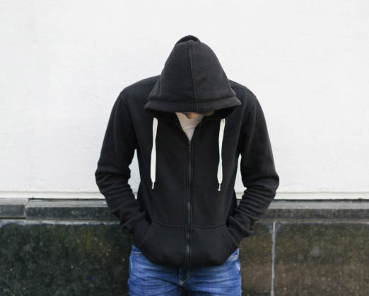 young man in black hoodie
