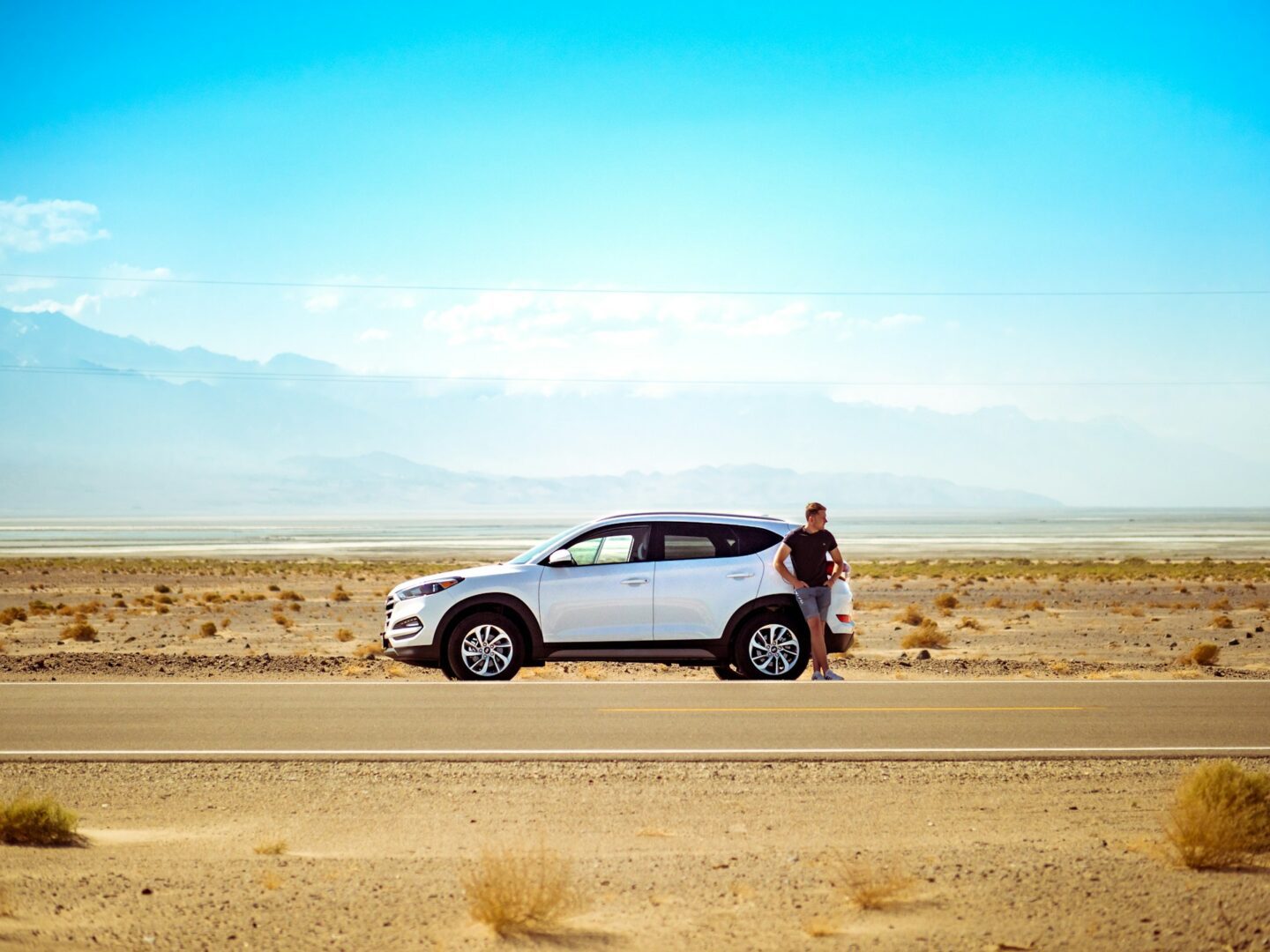 white car with man standing