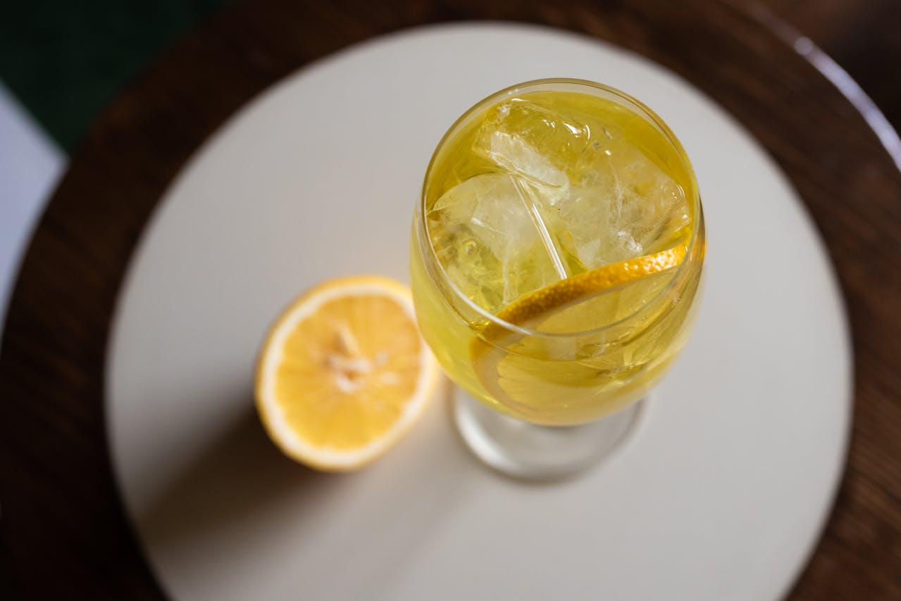 Close-Up Photo of a Beverage with Lemon