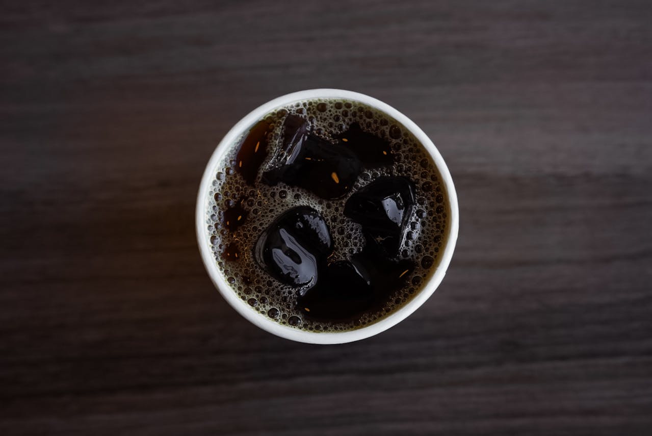 Top View of Iced Coffee in a White Cup
